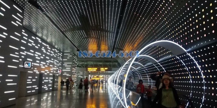 广州白云机场时光隧道墙面冲孔铝单板